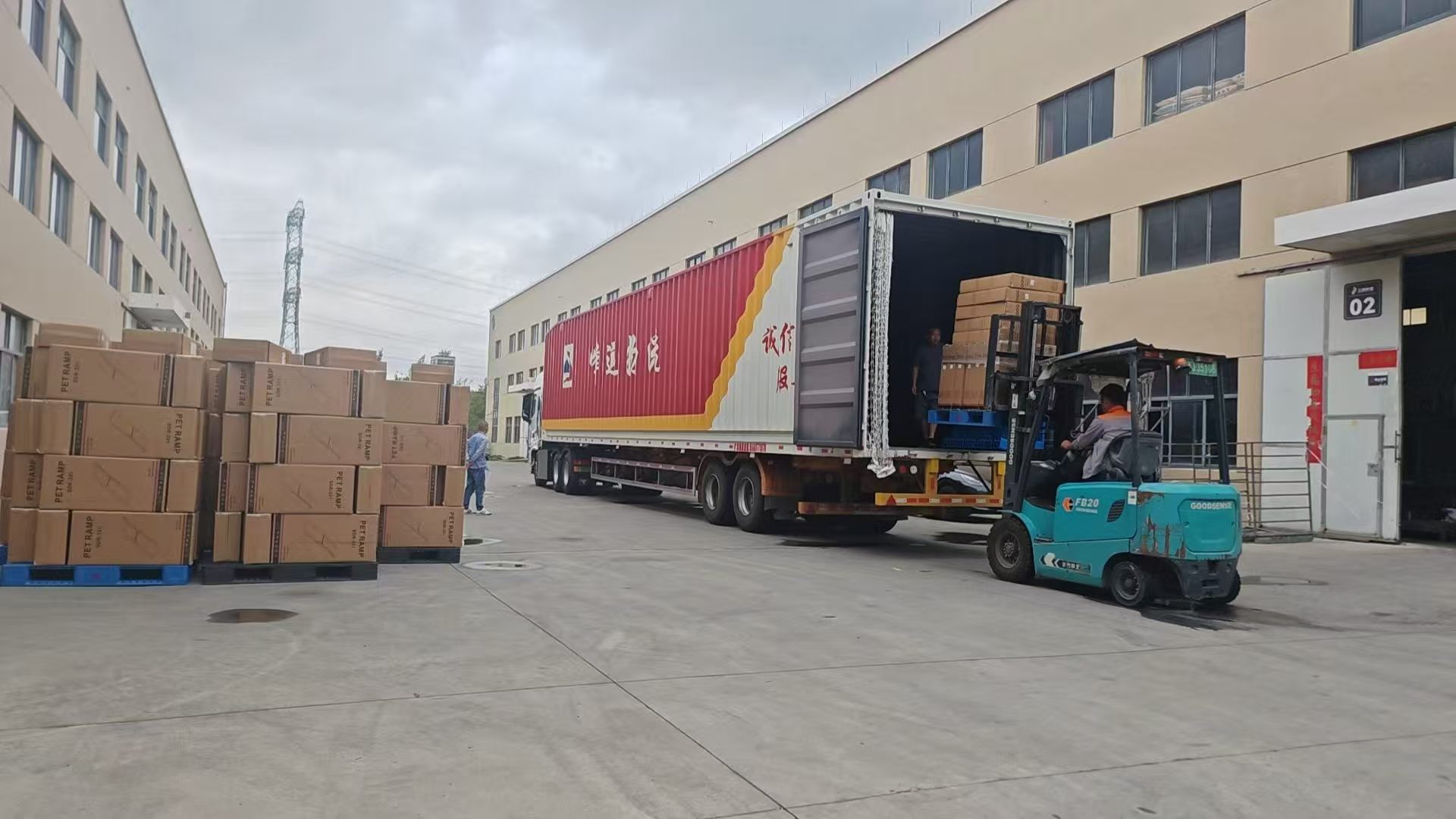 Forklift loading palletized pet product cartons into a truck at the Sanding factory.